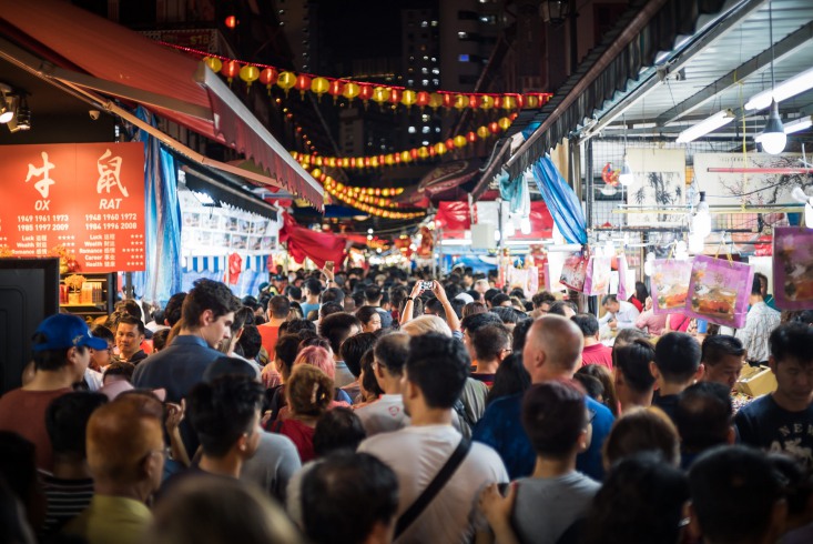 Crowds can be so massive that create human traffic jams on the narrow alleys of Chinatown street market.